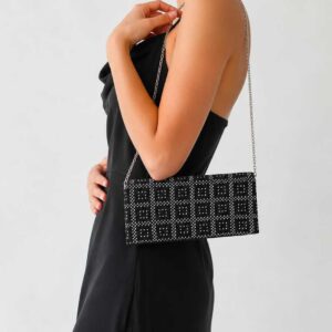 A handcrafted black tally bag with silver-coated thread embroidery and a metallic silver handle, made by the women artisans of Sohag. Size: 25x12 cm.